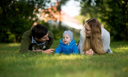 Father and daughter playing on grass