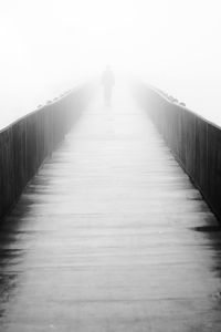 Full length of woman walking on road