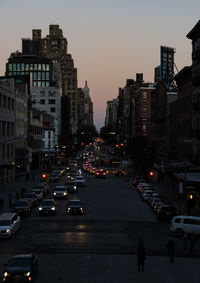 Traffic on city street at dusk