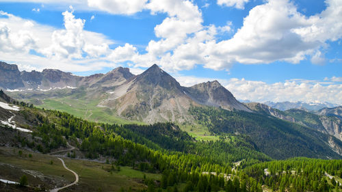 Scenic view of landscape and mountains against sky