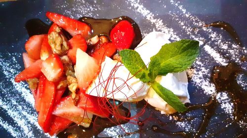 High angle view of chopped fruits in plate