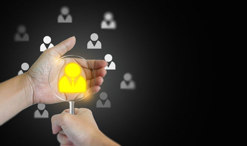 Close-up of hand holding thermometer