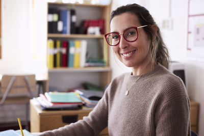 Female teacher working in classroom