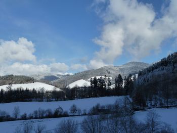 Scenic view of landscape against sky during winter