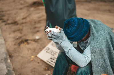 High angle view of man holding text