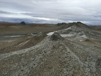 Scenic view of landscape against cloudy sky