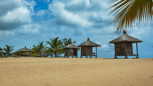 Built structure on beach against sky