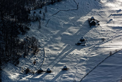 High angle view of people skiing on snowcapped mountain