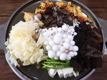 High angle view of chopped mushrooms in plate on table