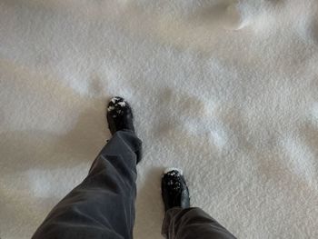 Low section of man standing on floor