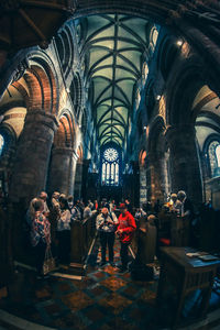 Group of people in temple outside building