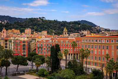 Buildings in city against sky