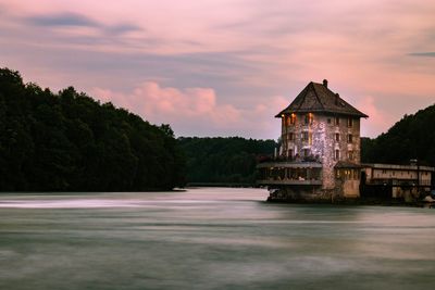 View of building against sky at sunset