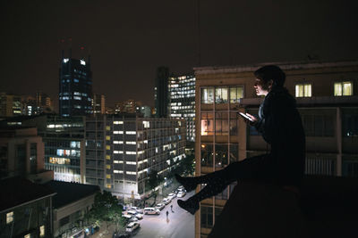 People standing in city at night