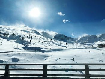 Scenic view of snow covered mountains against sky