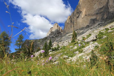 Scenic view of mountains against cloudy sky