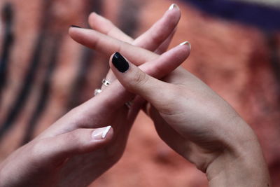 Cropped image of people holding hands