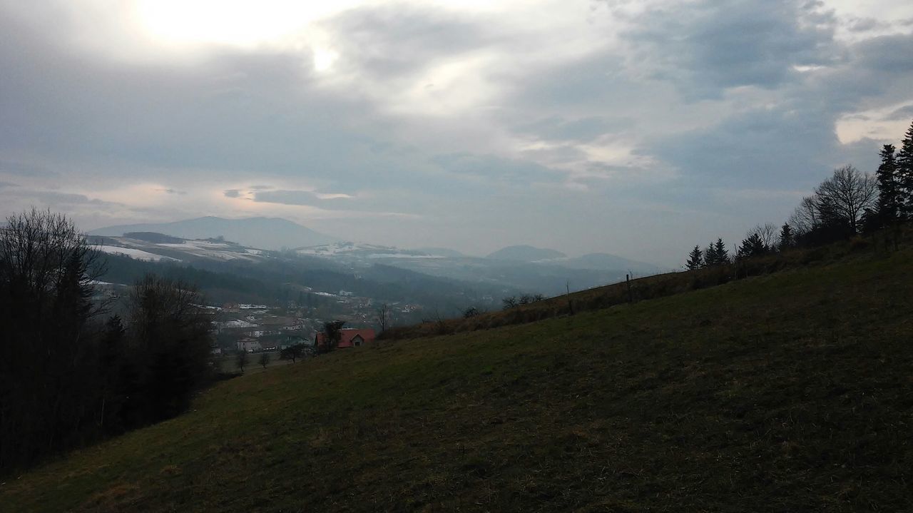 mountain, sky, landscape, tranquil scene, building exterior, cloud - sky, scenics, tree, tranquility, mountain range, beauty in nature, nature, grass, field, built structure, architecture, house, cloud, outdoors, growth