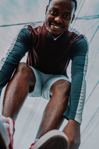 Portrait of a smiling young man standing outdoors