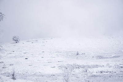 Scenic view of snow mountains against sky