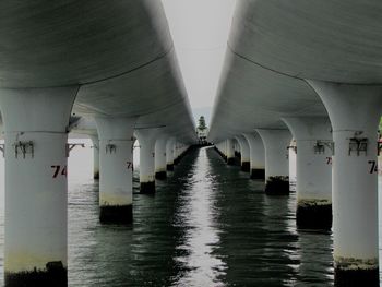 Reflection of bridge on water in building