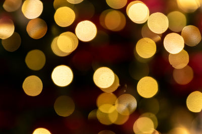 Golden glowing bokeh background. abstract bright led light backgdrop. defocused image.