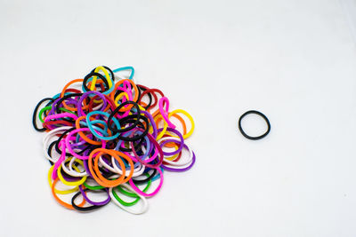 Close-up of multi colored candies against white background