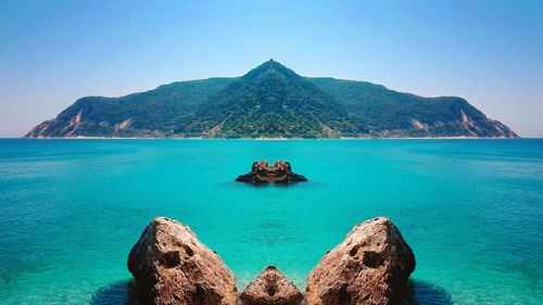 Panoramic view of sea against clear sky