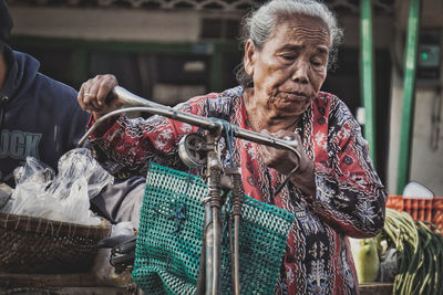 Portrait of woman with arms raised