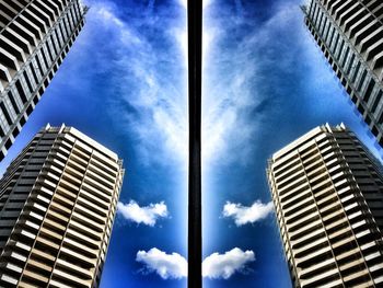 Low angle view of modern building against cloudy sky