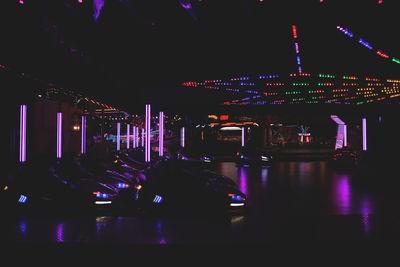 Illuminated ferris wheel at night