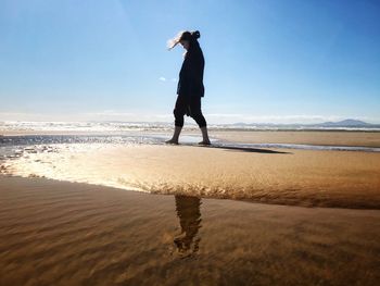 Full length of man standing on beach