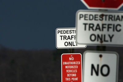 Pedestrian only signs warn away drivers of motorized vehicles on a walk path in culver, indiana.