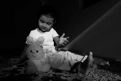 Boy playing with toy at home