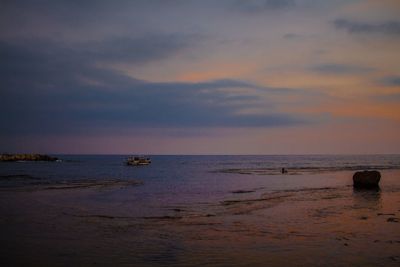 Scenic view of sea against sky at sunset