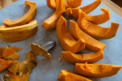 High angle view of chopped pumpkin on table