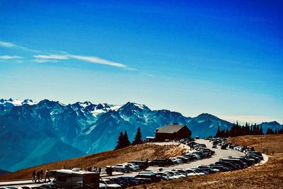 Scenic view of snowcapped mountains against blue sky