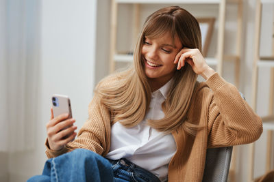 Young woman using mobile phone