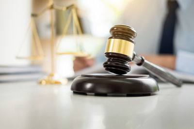 Close-up of gavel and hammer on desk