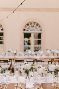 Flowers with place setting on dining table