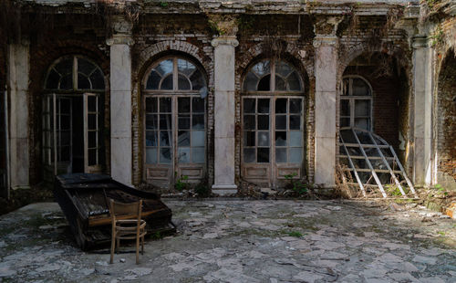 Chairs and table in abandoned building