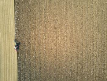 High angle view of man walking on road