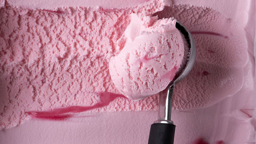 Close-up of ice cream against pink background