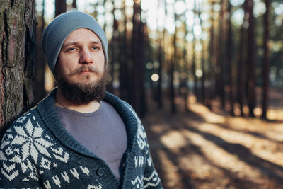 Portrait of young man in forest