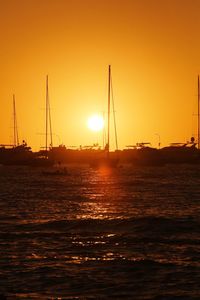 Scenic view of sea against orange sky