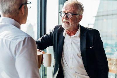 Man wearing hat standing outdoors