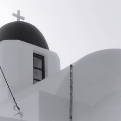 Low angle view of white building against clear sky