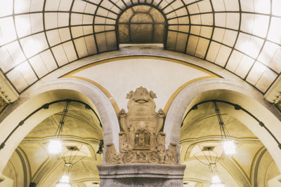 Low angle view of illuminated ceiling in building