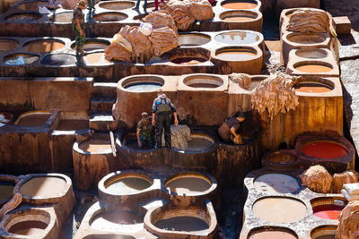 High angle view of men working at tannery