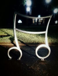 Close-up of empty coffee on street at night